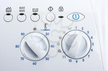 White control panel of modern washing machine
