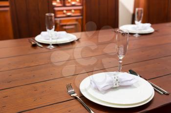 Elegean servered wooden table with plates