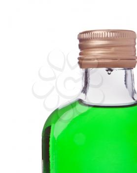 Close-up of a bottle with green alcohol