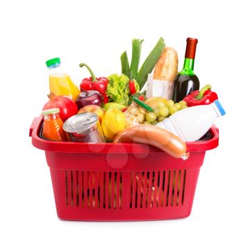 Basket full off fruits and vegetables. Isolated over white.
