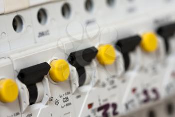 Close-up view of electrical fuseboxes in a row