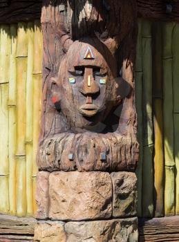 Wooden indigenous idol on the wall