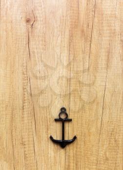 Anchor decor on the light wooden background