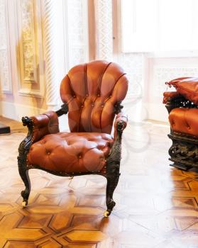 Luxuroius vintage leather-covered arm-chair in the room