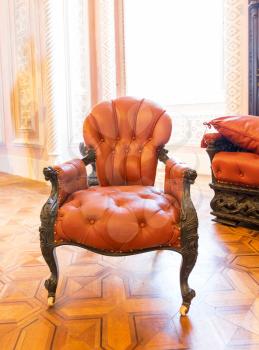 Luxuroius vintage leather-covered arm-chair in the room