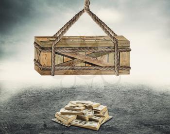 Big wooden box suspended above a pile of money over grey background
