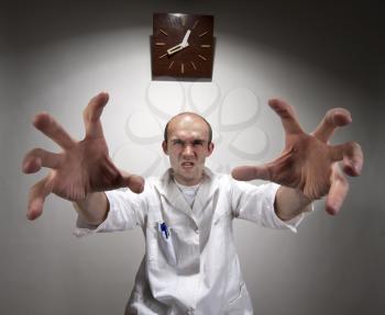 Ominous angry doctor reaching his long hands