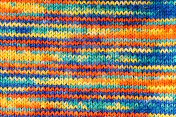 Knitted multicolored scarf. Texture or background
