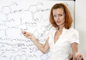 Sexy chemistry teacher in classroom