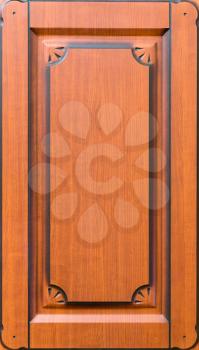 Wooden brown decorated facade of furniture closeup