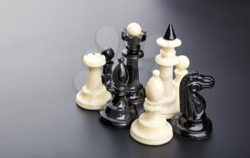Black and white chess figures on the table