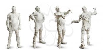 Four men in toilet paper isolated on white