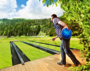 Man playing bowling on the lawn