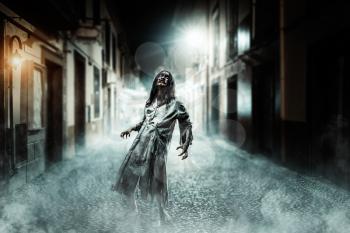 Horror zombie on the dark street. Halloween.