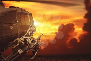 Military helicopter flying on sunset background. Military, army and war concept.