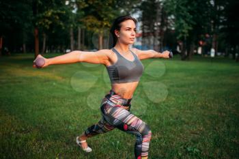 Athletic woman exercises, fitness training in park. Slim girl in sportswear, outdoor fit workout