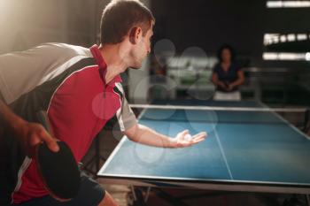 Table tennis, male player with racket and ball. Ping pong training indoor