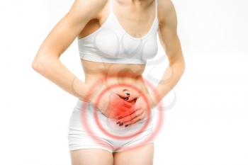 Stomach ache, woman with problem during menses, white background. Female person in lingerie, medical advertising or concept