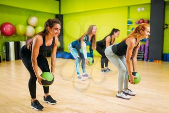 Women group with balls, fitness workout. Female sport teamwork in gym. Fit exercise, aerobic