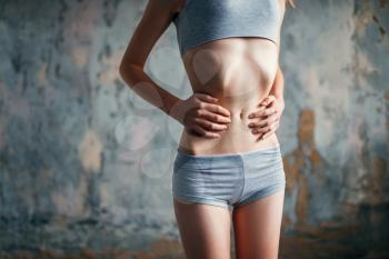 Female person with slim waist, weight loss, anorexia. Fat or calories burning concept, illness