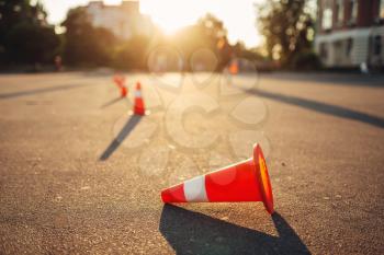Fallen cone on training ground for the examination, driving school concept. lesson for novice car drivers, test for beginner