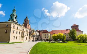 Wawel castle yard with lawn, panoramic view, Krakow, Poland. European town with ancient architecture buildings, famous place for travel and tourism