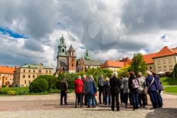 Touristic excursion in Wawel castle, Krakow, Poland. European town with ancient architecture buildings, famous place for travel and tourism