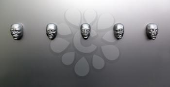 Different human emotions, sculptural mask on the wall, front view. Emotion concept, face models