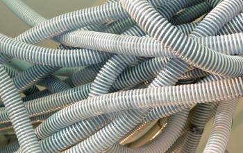 Pile of plastic cable tubes, bunch of wire tubing. Equipment for electrical isolation