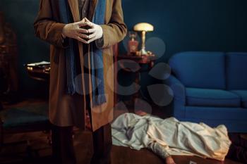 Male detective in gloves, victim under the cape at the crime scene, retro style. Criminal investigation, inspector is working on a murder, vintage room interior on background