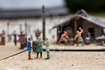 Viking settlement miniature outdoor, people fugurines, europe. Ancient european village, medieval Scandinavia, traditional scandinavian architecture, diorama