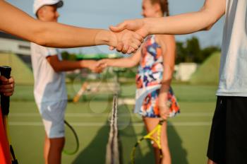 Mixed doubles tennis tournament, outdoor court. Active healthy lifestyle, people play sport game with racket and ball, fitness workout with racquets