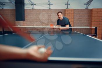 Table tennis, male and female ping pong players. Couple playing table-tennis indoors, sport game with racket and ball, active lifestyle