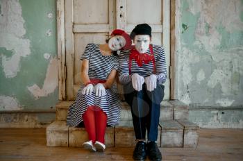 Two clowns, mime artists, parody comedy. Pantomime theater, comedian, positive emotion, humour performance, funny face mimic and grimace