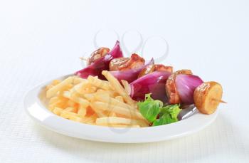Bacon and potato skewer with French fries