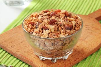 Bowl of mixed breakfast cereals and dried fruit