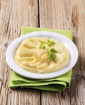 Mashed potato and a curl of fresh butter