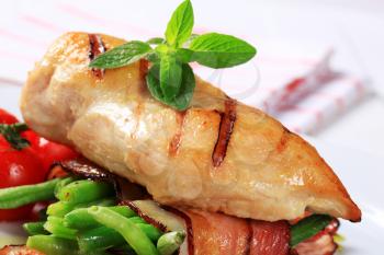 Grilled chicken breast with string beans wrapped in bacon