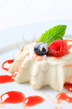 Panna cotta with fruit coulis and wild berries