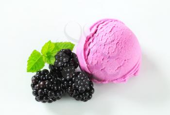 Scoop of fruit ice cream with fresh blackberries
