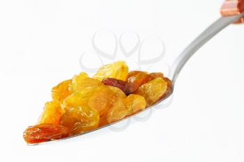 Sultana raisins on a spoon