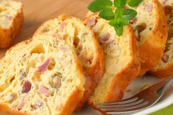 Slices of savory ham and olive cake