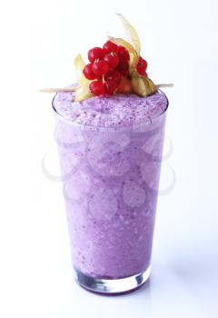 Blueberry smoothie in a tall glass - studio