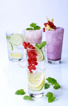 Glasses of soda with lime and fruit smoothies 