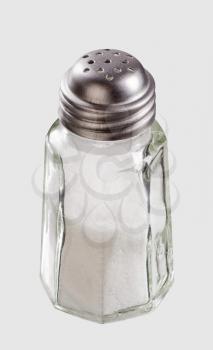 Closeup of a glass salt shaker
