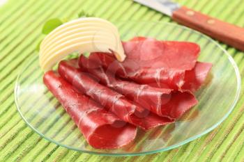 Thin slices of dried meat and butter