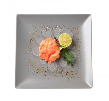 Gravlax garnished with lime, dill and seasoning