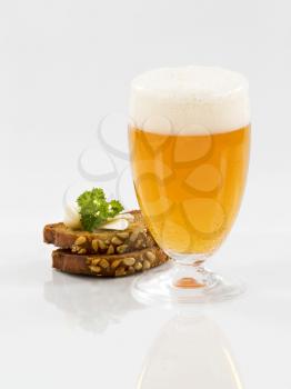 Toasted brown bread, garlic and a glass of beer