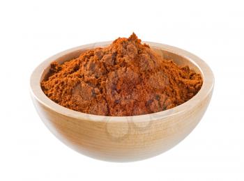 Ground red pepper in a wooden bowl