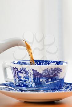 Pouring a cup of tea - detail